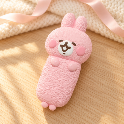 Kanahei Squishy Toy in a warm wooden-table lifestyle scene